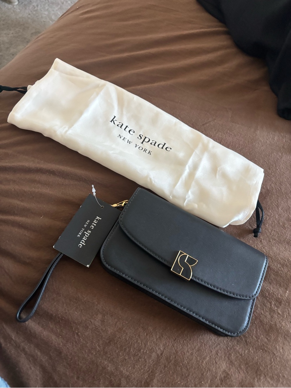 kate spade black leather crossbody wristlet with gold-tone clasp